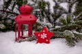 Christmas Star Ornament And Lantern In The Snow