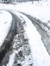 Winters Labor Fresh Tire Tracks Through Snowy Street Royalty Free Stock Photo