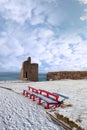 Winters view of ballybunion castle and red benches Royalty Free Stock Photo