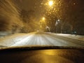 Winterscape night time car driving in a snow