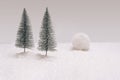 Wintertide inspired concept. Minimal arrangement with two trees with avalanche in background