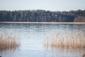 Wintertime is coming. Lake overlaps with thin layer of ice.