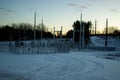 Wintertime at an electrical substation in the forest at sunset Royalty Free Stock Photo