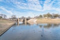 Urban park bare tree, altocumulus cloud, fountain lake in Texas, USA