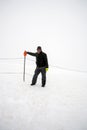 Wintertime: time to have fun in a ski resort. Snow, mountaintop, haziness, skiing.