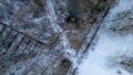 Wintery Aerial Tapestry: A Bird's Eye View of Snow-Dusted Woodland and Stream