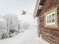 Cozy, winter cabin nestled in the snowy woods, Sweden Royalty Free Stock Photo