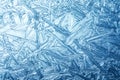 Wintry background with winter frost covered window with a pattern of ice crystals Royalty Free Stock Photo