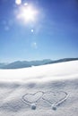 Wintry bavarian landscape with love hearts and bright sunshine w Royalty Free Stock Photo