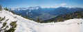 Wintry hiking path at Wank mountain, view to Zugspitze and tourist resort Garmisch-Partenkirchen