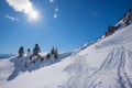 wintry hiking trail Rofan alps austria, bright sunshine and blue sky