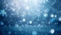 Wintry ice blue background with bokeh of snowflakes and sparkling light particles Royalty Free Stock Photo