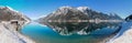 Wintry lake shore Achensee with view to beautiful Rofan mountains and water reflection, tourist destination Pertisau austria