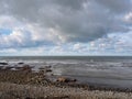 Wintry pebble beach, UK, generic, with stormy grey sky.