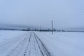 wintry road late afternoons in the countryside Royalty Free Stock Photo