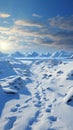 Wintry trek Footprints ascend hill as humans venture through snow covered landscape