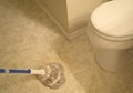 Wiped the bathroom tiled floor with mop Royalty Free Stock Photo