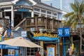 WipeOut Bar and Grill, Fog Harbor Fish House with people walking at Fisherman\'s Wharf on Pier 39 in San Francisco California