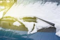 Wipers on a car in the snow close-up, toned