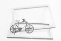Wire bicycle model,paper frame on white background