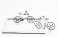 Wire bicycle model,paper frame on white background