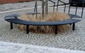 wire circular benches park furniture in winter. sintered gravel with