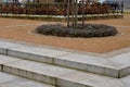 wire circular benches park furniture in winter. sintered gravel with