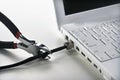 Wire Cutters Cutting Cable to Laptop Royalty Free Stock Photo