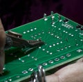 Wire cutting of soldered circuit board Royalty Free Stock Photo