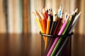 Wire desk tidy full of coloured pencils Royalty Free Stock Photo