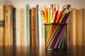 Wire desk tidy full of coloured pencils Royalty Free Stock Photo