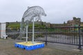 Dolphin statue on Isle of Man Royalty Free Stock Photo