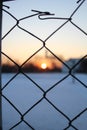 Wire fence and the basketball court,winter time Royalty Free Stock Photo