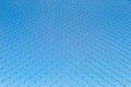 Wire fence or metal net on blue sky background