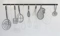 Wire kitchen utensils hang on the white wall Royalty Free Stock Photo