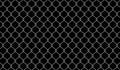 Wire mesh for background, barrier net on dark, wire net metal wall, barbed wire fence, metal grid wire for backdrop, fence barb Royalty Free Stock Photo