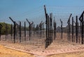 Wire mesh and barbed wire. Royalty Free Stock Photo