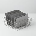 A wire mesh basket holds several gray file folders, neatly organized upright. The Royalty Free Stock Photo