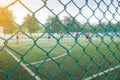 Wire mesh fence from football field with competitive. Royalty Free Stock Photo