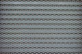 Wire mesh fence on gray steel