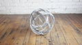 Wire sphere art studio floor white brick Royalty Free Stock Photo