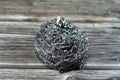 Wire sponge, steel wool, a bundle of very fine and flexible sharp edged steel or metal filaments that is great for cleaning glass