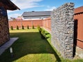 Wire and stone fence. decorative building made of stone Gabion