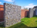 Wire and stone fence. decorative building made of stone Gabion