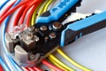 Wire stripper and cutter closeup with colored power cords Royalty Free Stock Photo