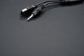 Wire with a USB end and audio cable on a black background Royalty Free Stock Photo