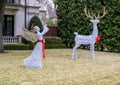 Wire white angel and reindeer Christmas decorations in the yard of a mansion in Highland Park, Texas.