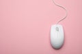 Wired computer mouse on pink background. Space for text Royalty Free Stock Photo