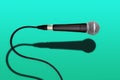 Wired singer black and grey microphone on green
