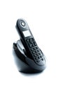 Wireless black telephone with cradle isolated on white background Royalty Free Stock Photo